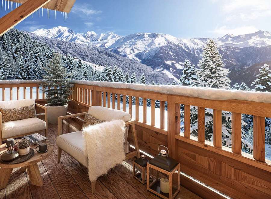 Luxury chalet balcony with breathtaking mountain views.
