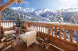 Luxury chalet balcony with breathtaking mountain views.