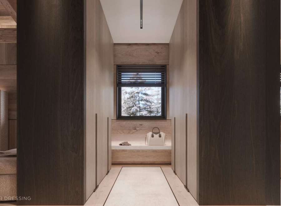 This luxurious master dressing boasts a spacious layout with ample built-in storage, highlighted by rich dark wood finishes and a calming neutral color palette.