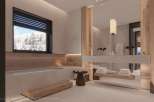 Luxurious master bathroom boasts a freestanding soaking tub, sleek floating vanity, and stunning mountain views.