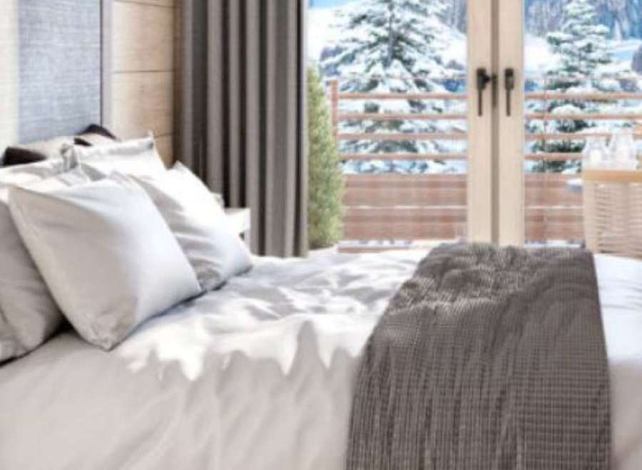 Wake up to breathtaking mountain views from this luxurious bedroom.
