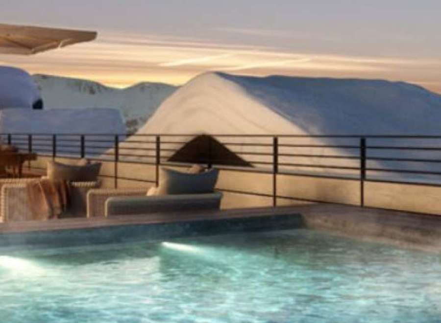 Luxury chalet with stunning mountain views and a private rooftop hot tub.