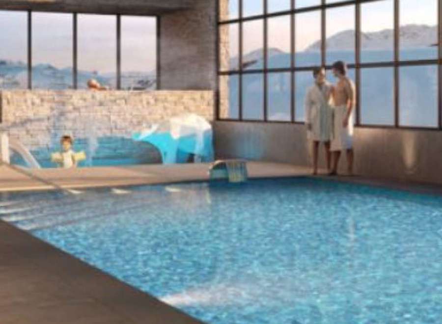 Indulge in our luxurious indoor pool, surrounded by stunning mountain views.