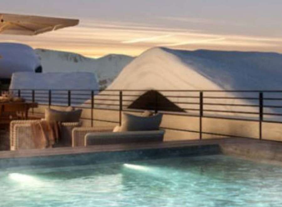 Luxury rooftop retreat with stunning mountain views and a private heated pool.