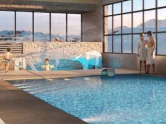 Luxury hotel with indoor pool and stunning mountain views.
