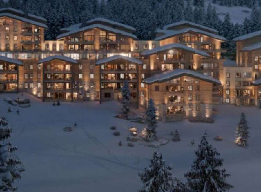 Luxury chalet-style apartments nestled in a snowy mountainside setting.