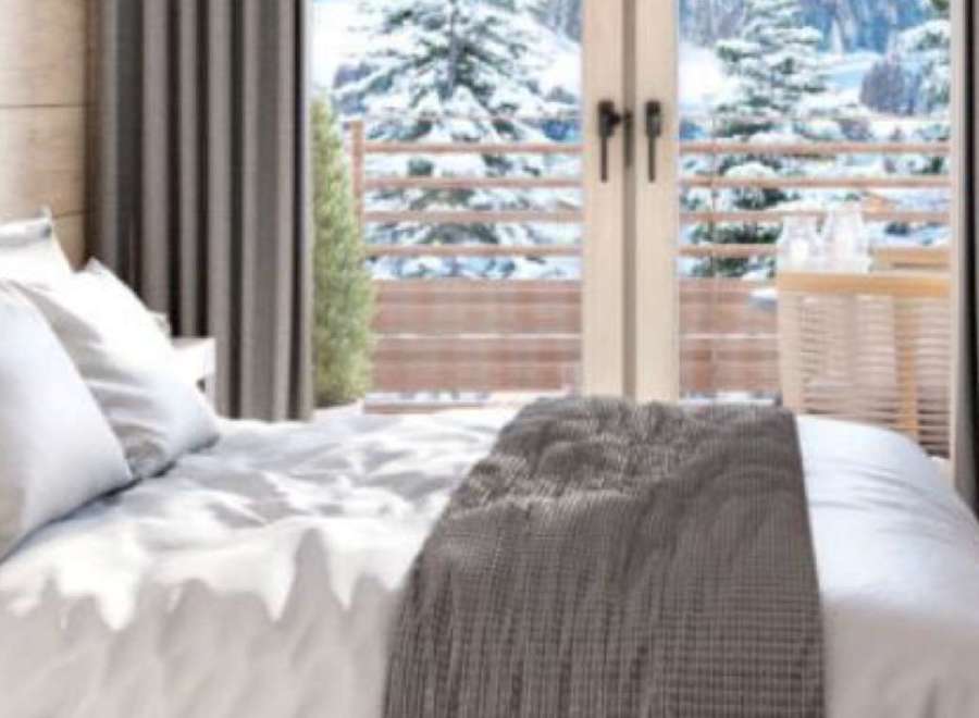 Wake up to breathtaking mountain views from this cozy bedroom.
