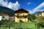 Discover a charming house nestled in a picturesque mountain setting.