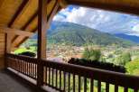Enjoy breathtaking mountain views from this charming balcony.