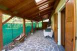 Discover a charming property with a unique covered patio, perfect for enjoying the outdoors in any weather.