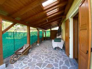 Discover a charming property with a unique covered patio, perfect for enjoying the outdoors in any weather.