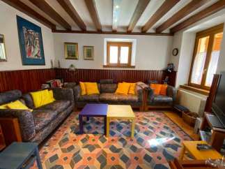 Step into a cozy living room with a unique geometric patterned rug.