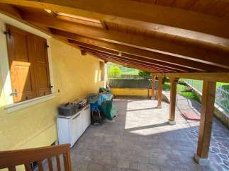 Discover the charm of this property featuring a covered patio, perfect for outdoor relaxation.