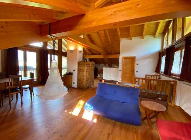 This stunning property boasts a unique architectural design with exposed wooden beams and a spacious, open-plan layout.