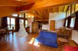 This stunning property boasts a unique architectural design with exposed wooden beams and a spacious, open-plan layout.