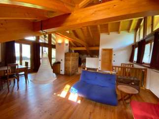 This stunning property boasts a unique architectural design with exposed wooden beams and a spacious, open-plan layout.
