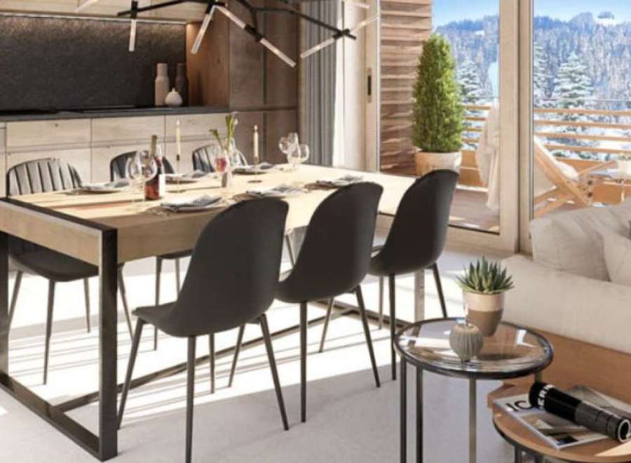 This stunning apartment boasts a spacious open-plan living area with floor-to-ceiling windows offering breathtaking mountain views.