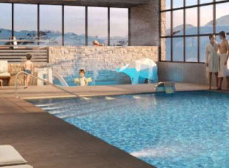 Luxury hotel with indoor pool and stunning mountain views.