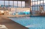 Luxury hotel with indoor pool and stunning mountain views.