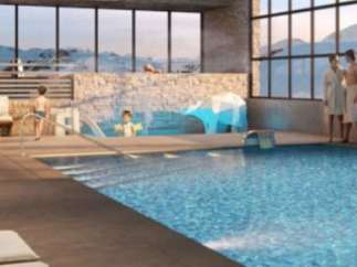 Luxury hotel with indoor pool and stunning mountain views.