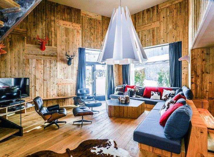 Experience rustic luxury in this stunning chalet-style living room.