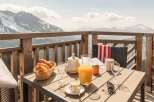 Enjoy breathtaking mountain views from this stunning balcony.