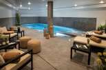 Indulge in the ultimate relaxation experience in this luxurious indoor pool and spa area.