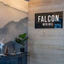 This stunning Méribel chalet boasts a stylish reception area with a sleek, modern design.