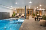 Indulge in the ultimate relaxation experience at this stunning property, featuring a luxurious indoor pool and spa area.