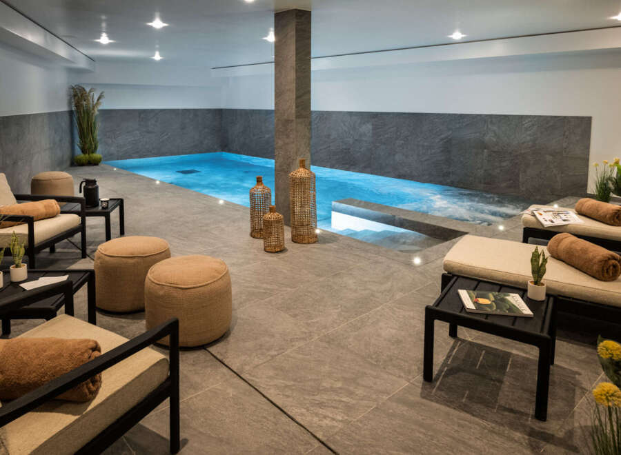 Indulge in the ultimate relaxation experience with this stunning indoor pool and spa.