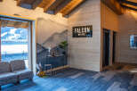 This stunning chalet boasts a spacious and inviting lobby, featuring a cozy seating area with a mountain view.