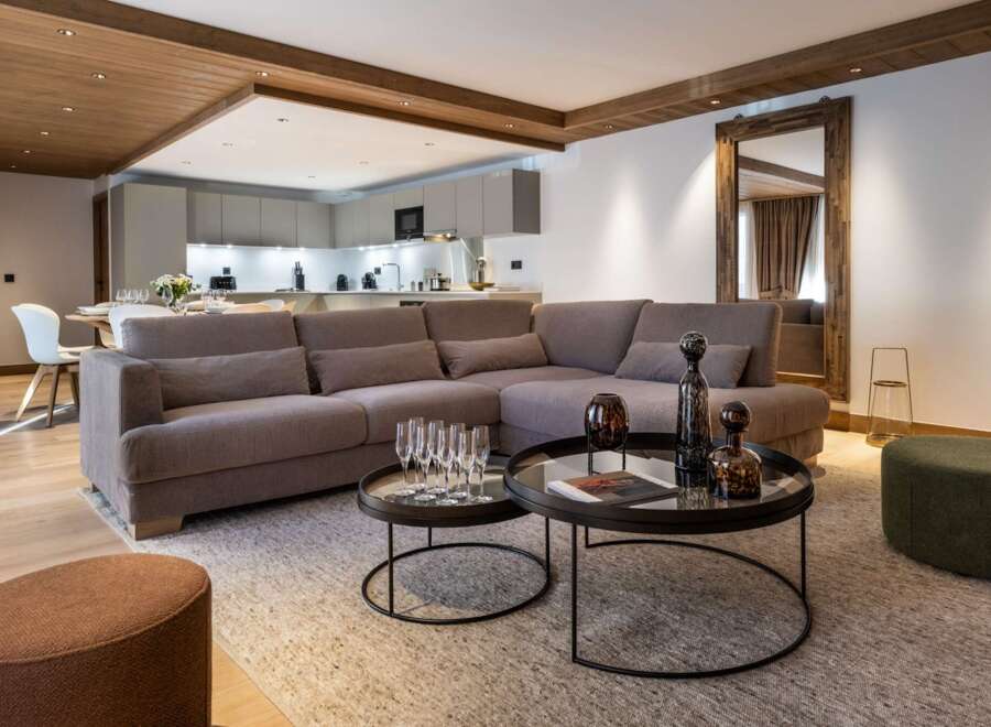 Experience luxury living in this stunning property, featuring a spacious open-plan living area with a modern kitchen.