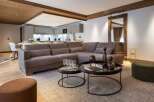 Experience luxury living in this stunning property, featuring a spacious open-plan living area with a modern kitchen.