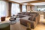 Experience luxury living in this stunning property, featuring a spacious living room with a comfortable sectional sofa, perfect for relaxation.