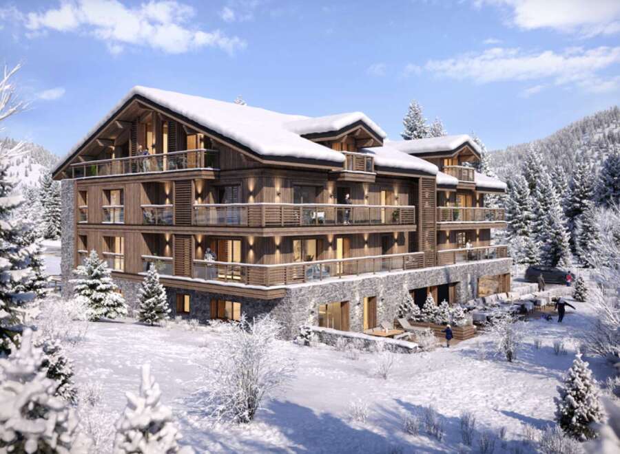 This stunning chalet-style apartment building offers luxurious ski-in/ski-out living in a breathtaking snowy mountain setting.