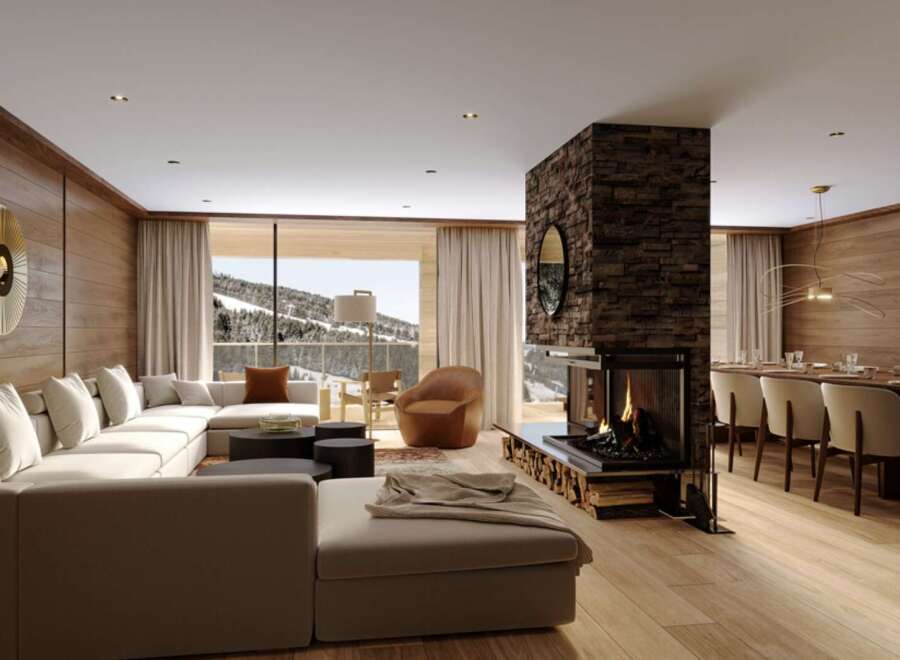 This luxurious chalet boasts an open-plan living area with a stunning fireplace as the centerpiece, creating a warm and inviting atmosphere.
