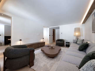 Experience luxury living in this stunning property, featuring a spacious living room with a modern design.