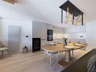 Experience modern luxury in this stunning property, featuring a beautifully designed kitchen with sleek cabinetry and top-of-the-line appliances.