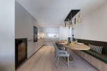 This modern kitchen and dining area offers a seamless blend of style and functionality.