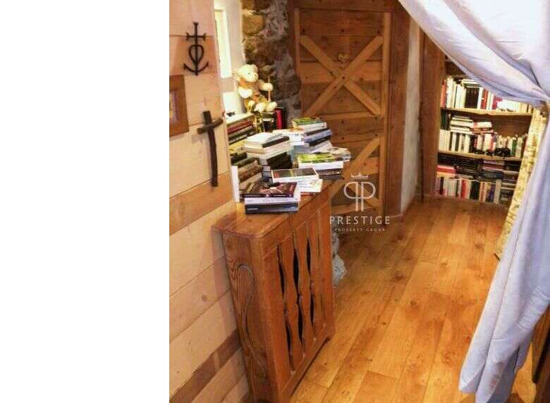 Discover the charm of this property, featuring a cozy wooden interior and a warm, inviting atmosphere.