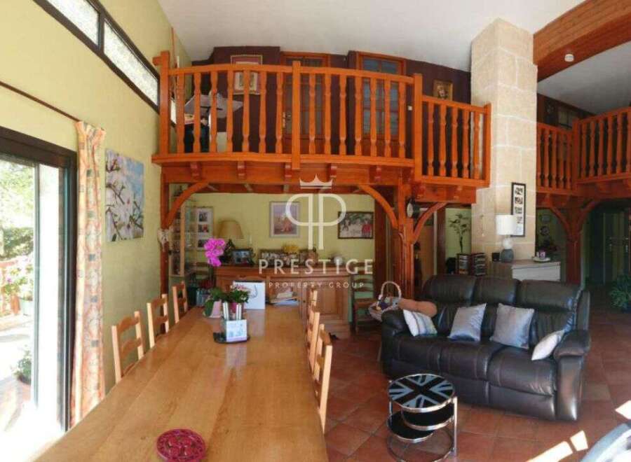 Discover the charm of this unique property featuring a stunning wooden mezzanine, perfect for creating a cozy living space.