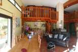 Discover the charm of this unique property featuring a stunning wooden mezzanine, perfect for creating a cozy living space.