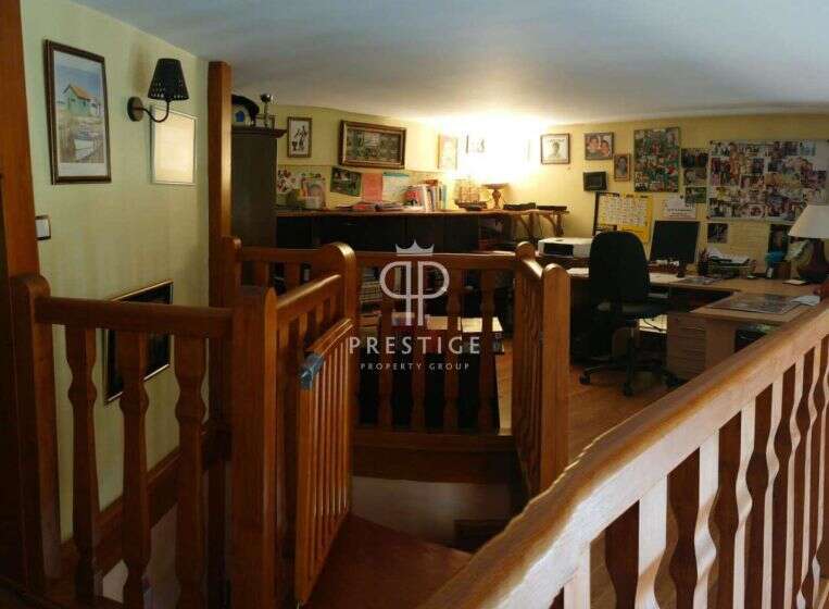 Discover the charm of this property, featuring a warm and inviting interior with wooden accents.