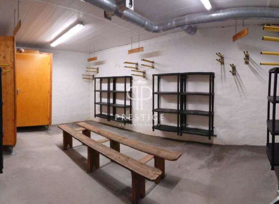 Discover a unique property with a functional storage area.