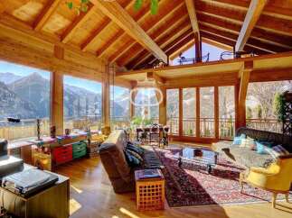 Experience the epitome of luxury living in this stunning chalet, boasting breathtaking mountain views.