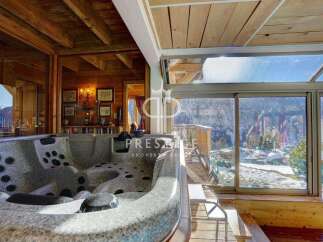 Indulge in luxury with this stunning property featuring a private hot tub.
