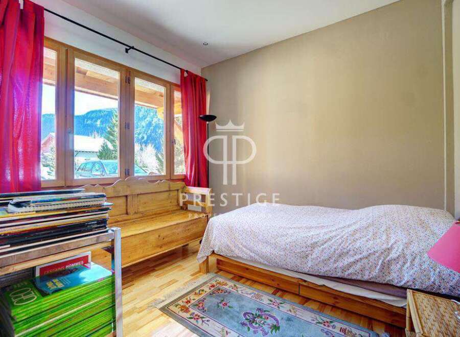 Discover a cozy bedroom with stunning mountain views.