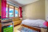 Discover a cozy bedroom with stunning mountain views.