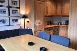 Discover a charming property with a cozy dining area, perfect for intimate gatherings.