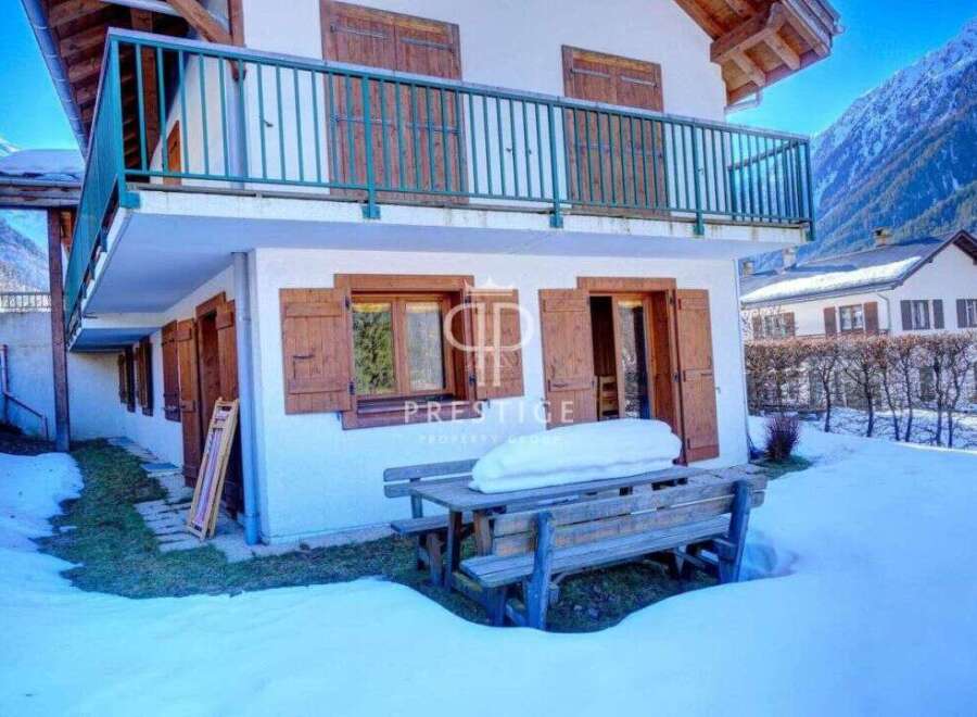Discover a charming property nestled in a snowy landscape, perfect for a cozy retreat.